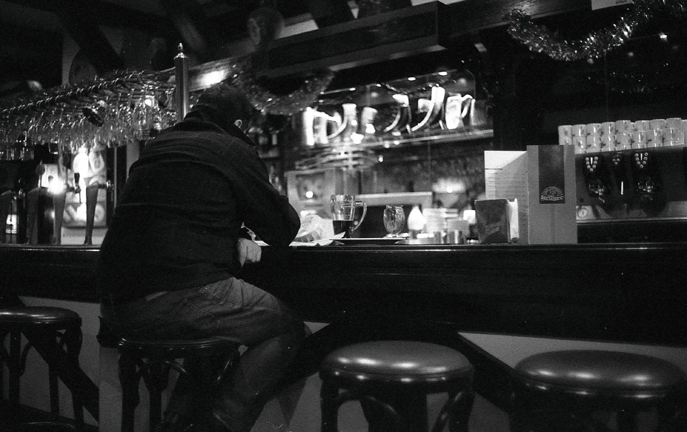 Man at a bar in black and white