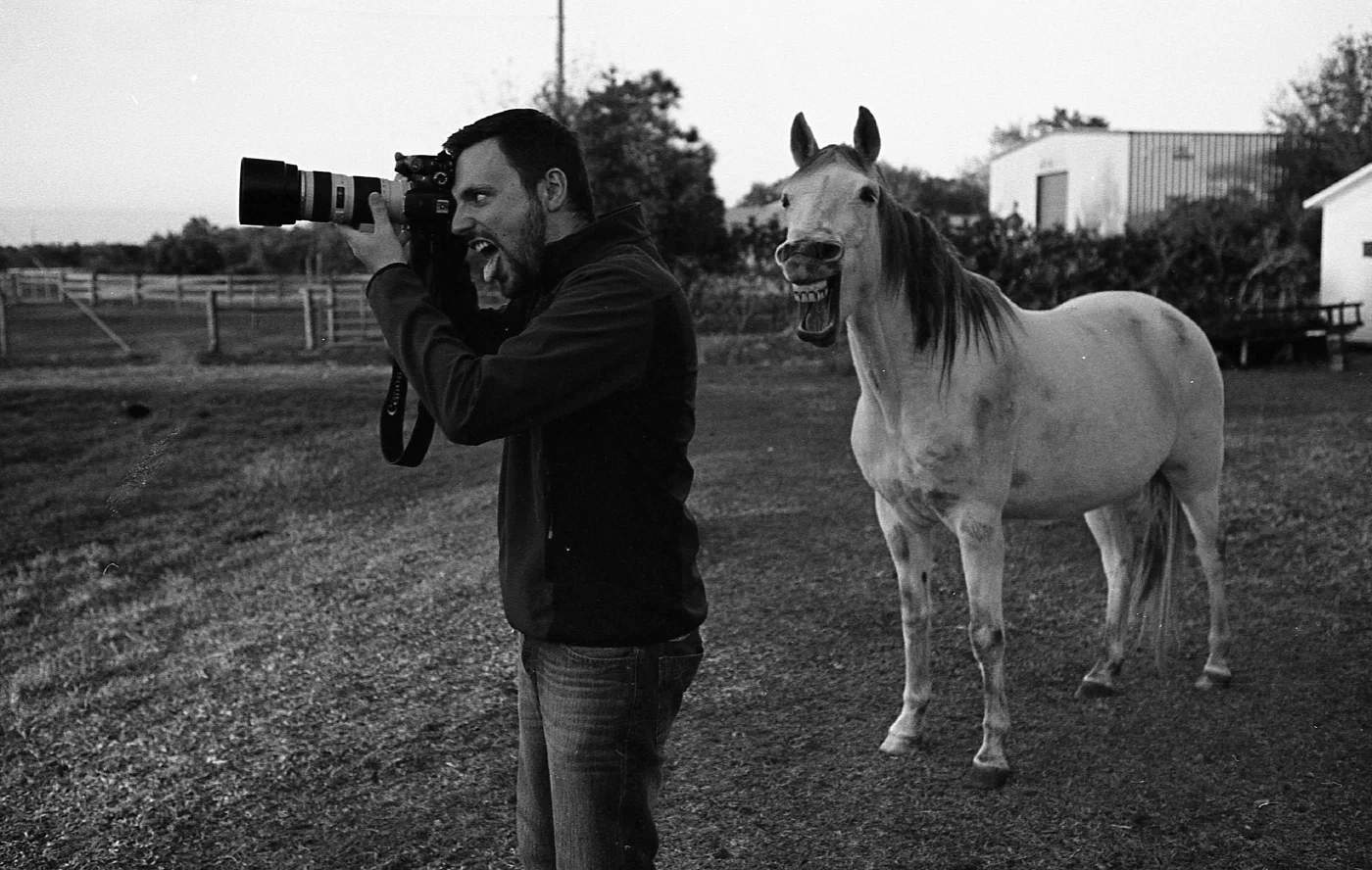 Black and white picture of a man with a horse